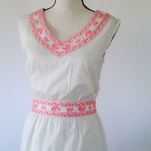 black rivet top off white embroidered trim